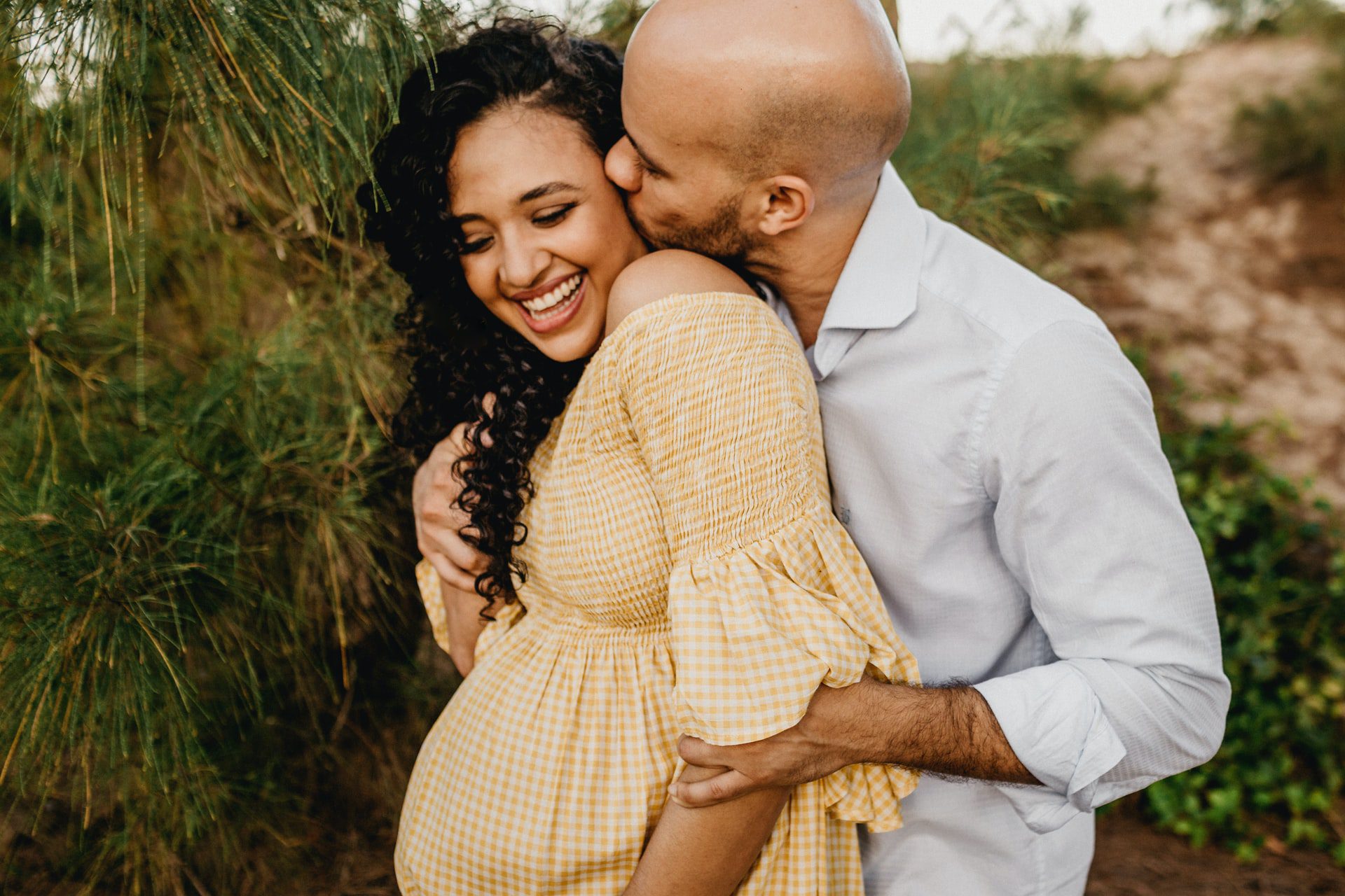 Young pregnant couple celebrating without medical marijuana