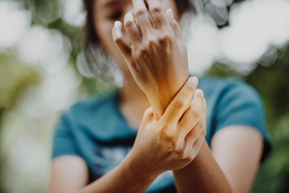Close,Up,Young,Woman,Left,Wrist,Pain,,,Office,Syndrome